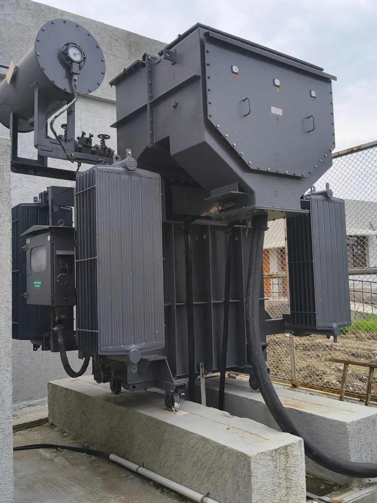 Radiator cooling bank on the side of an oil-filled transformer
